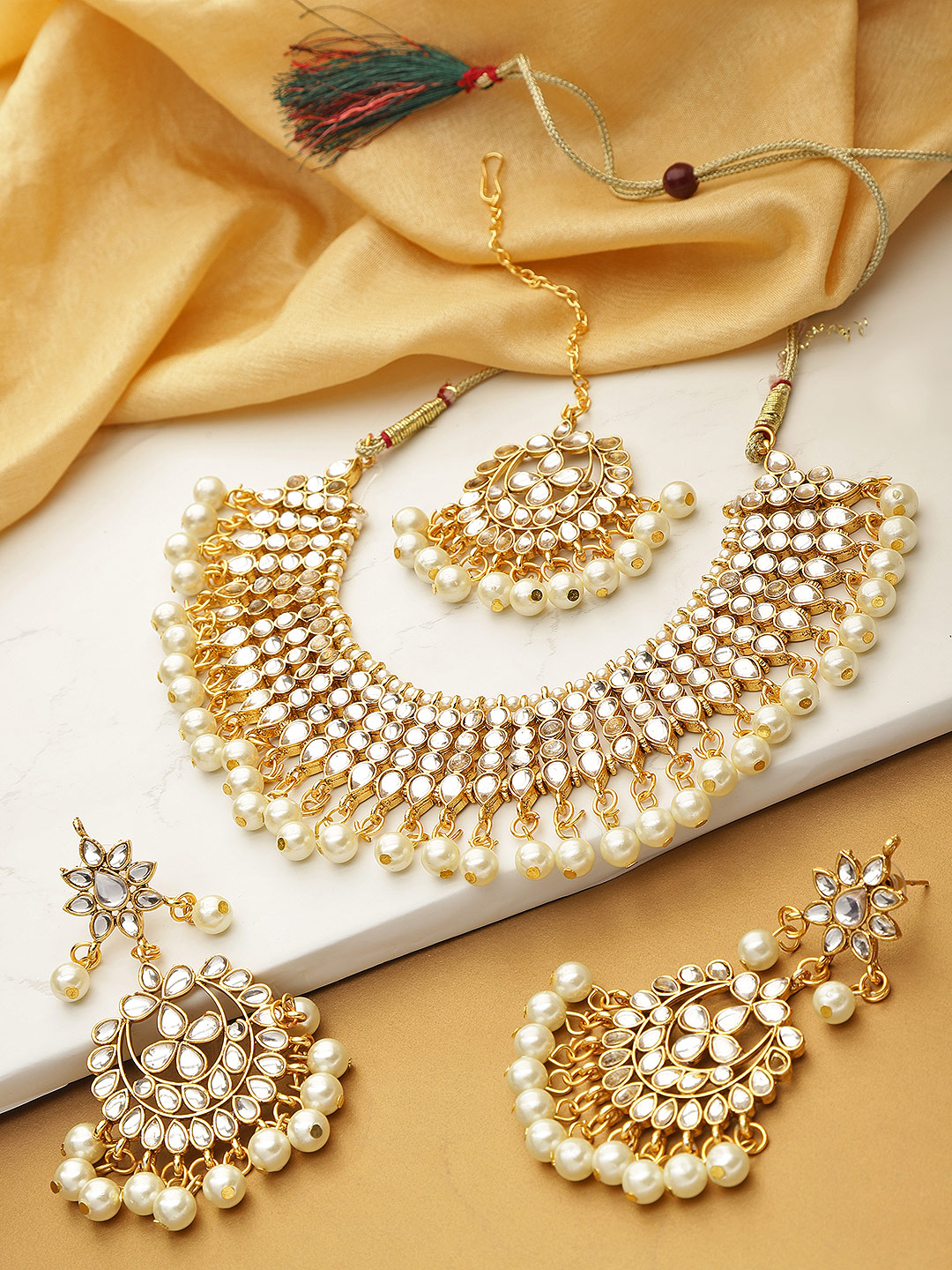 YouBella Cream-Coloured Gold-Plated Stone-Studded Handcrafted Jewellery Set